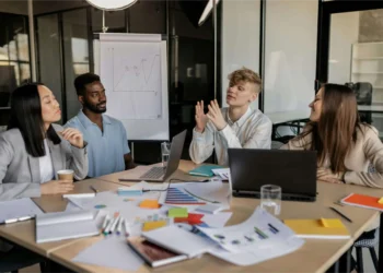 A group of executives inside a meeting room taking entrepreneurial decisions